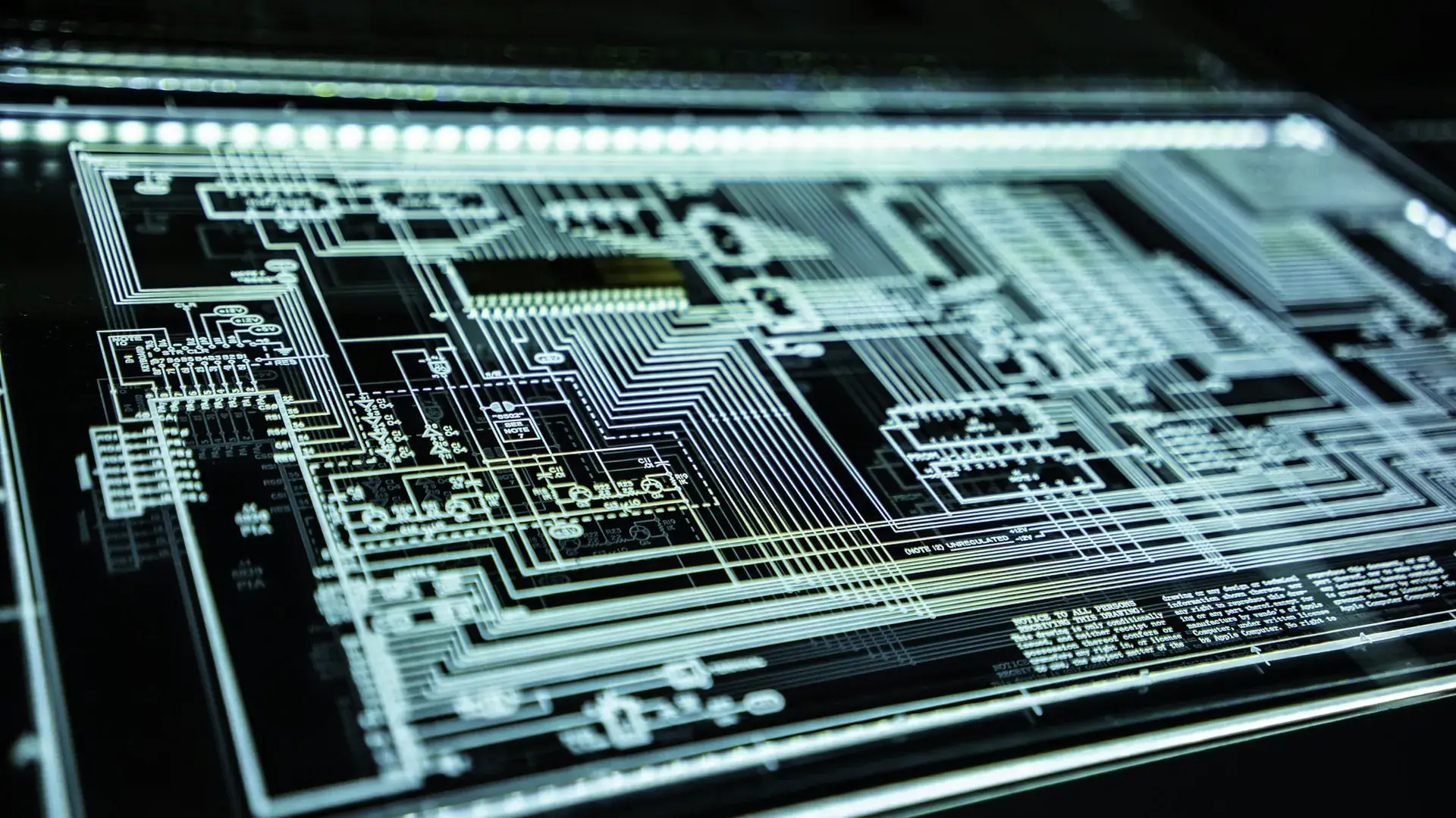 Macro photograph of a circuit board lit in blue